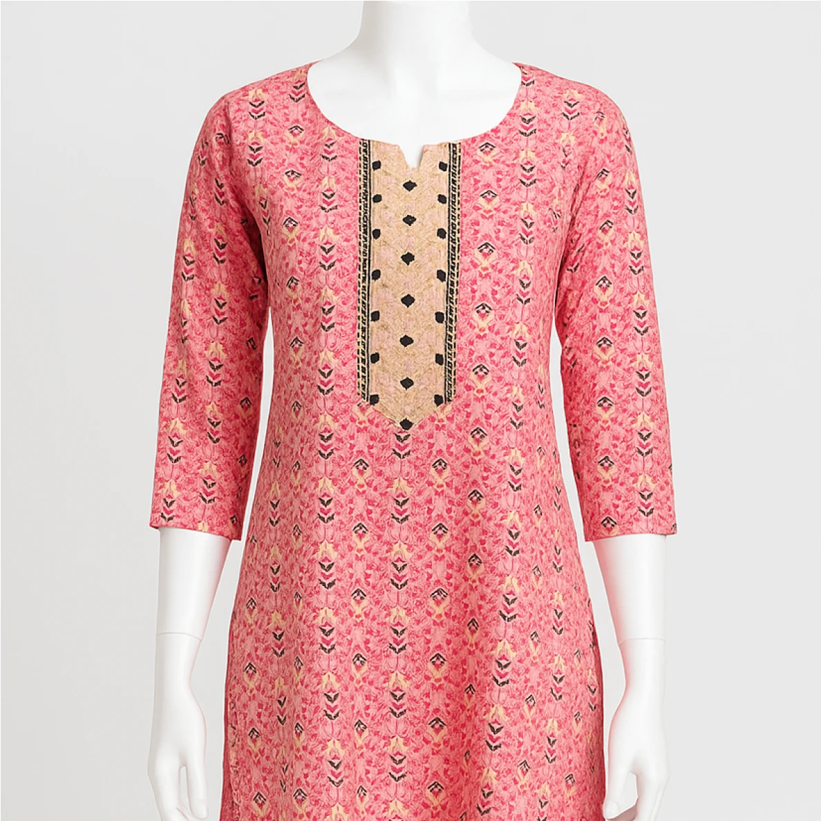 Pink patterned kurta on a mannequin against a white background