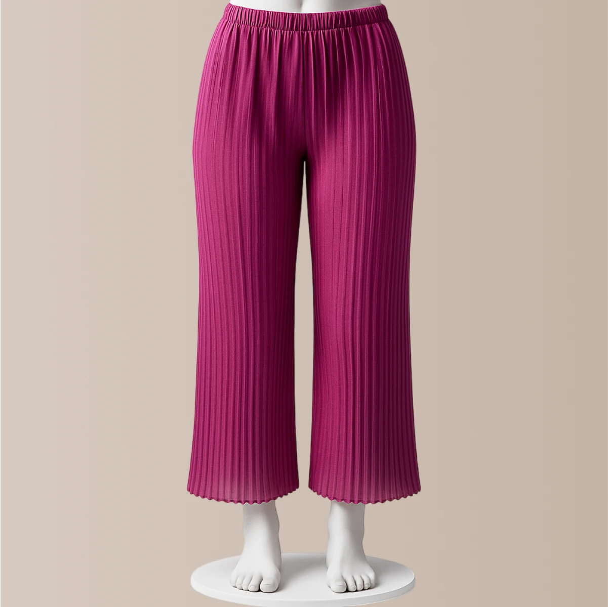 Pink pleated pants on a mannequin against a beige background