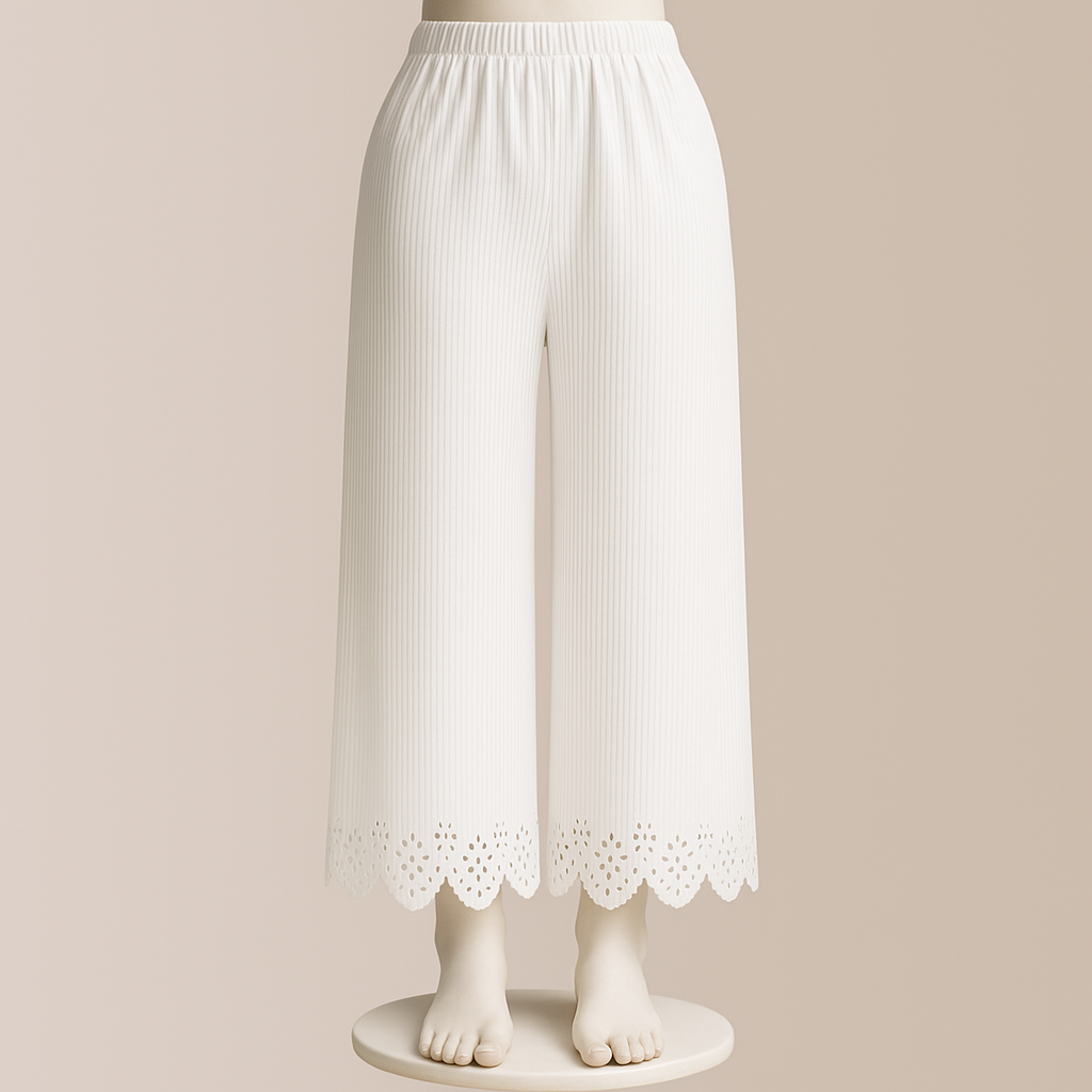 White ribbed pants with lace trim on a mannequin against a beige background