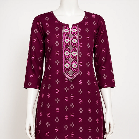 Maroon dress with geometric pattern on a mannequin against a white background