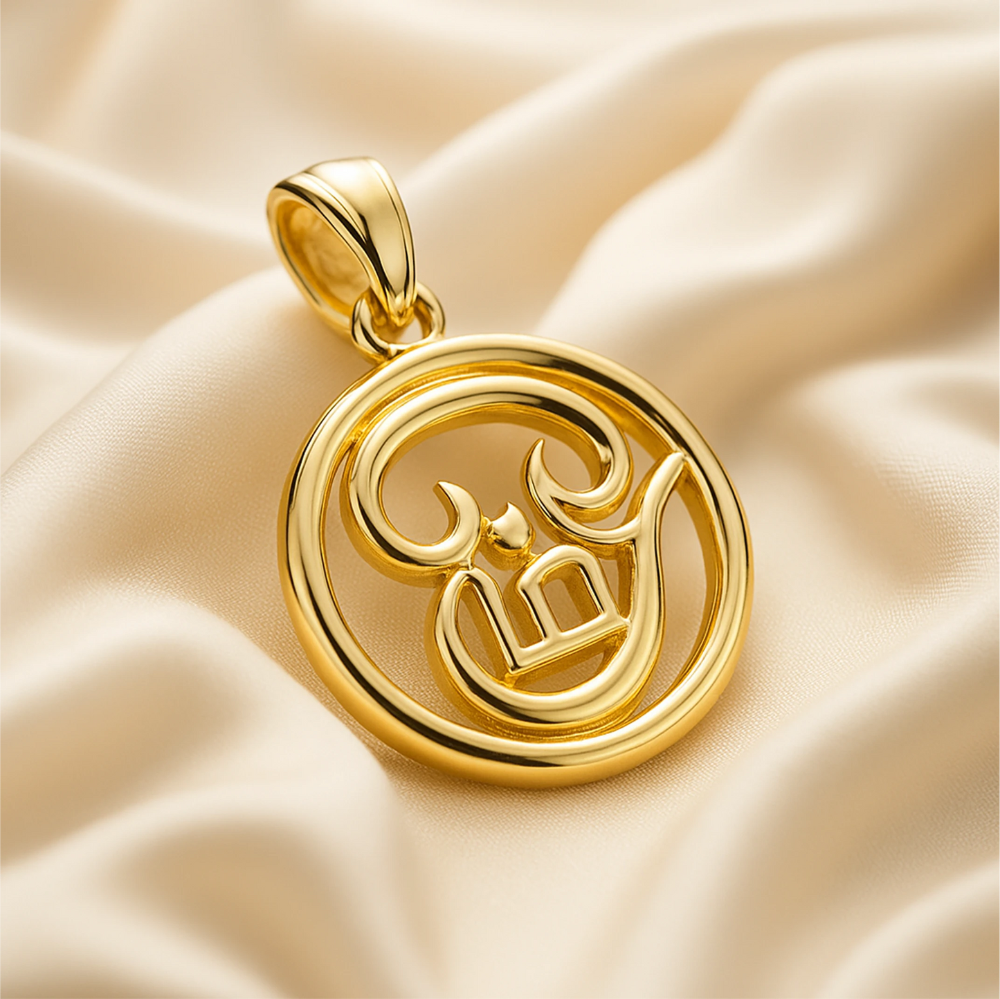 Gold pendant with intricate design on a beige fabric background