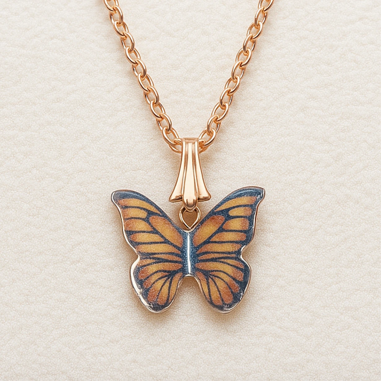 Butterfly pendant necklace on a light beige background