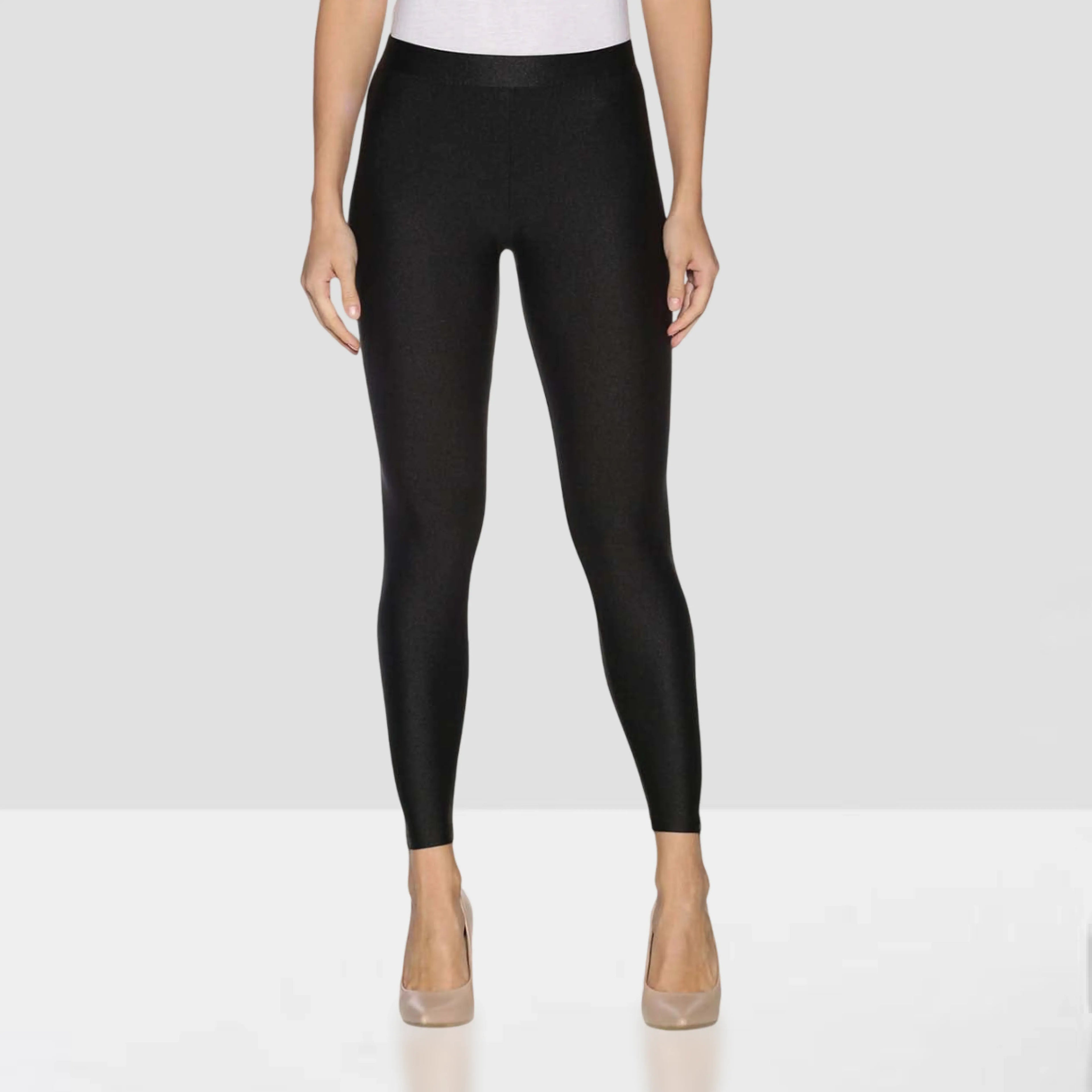 Person wearing black leggings on a white background