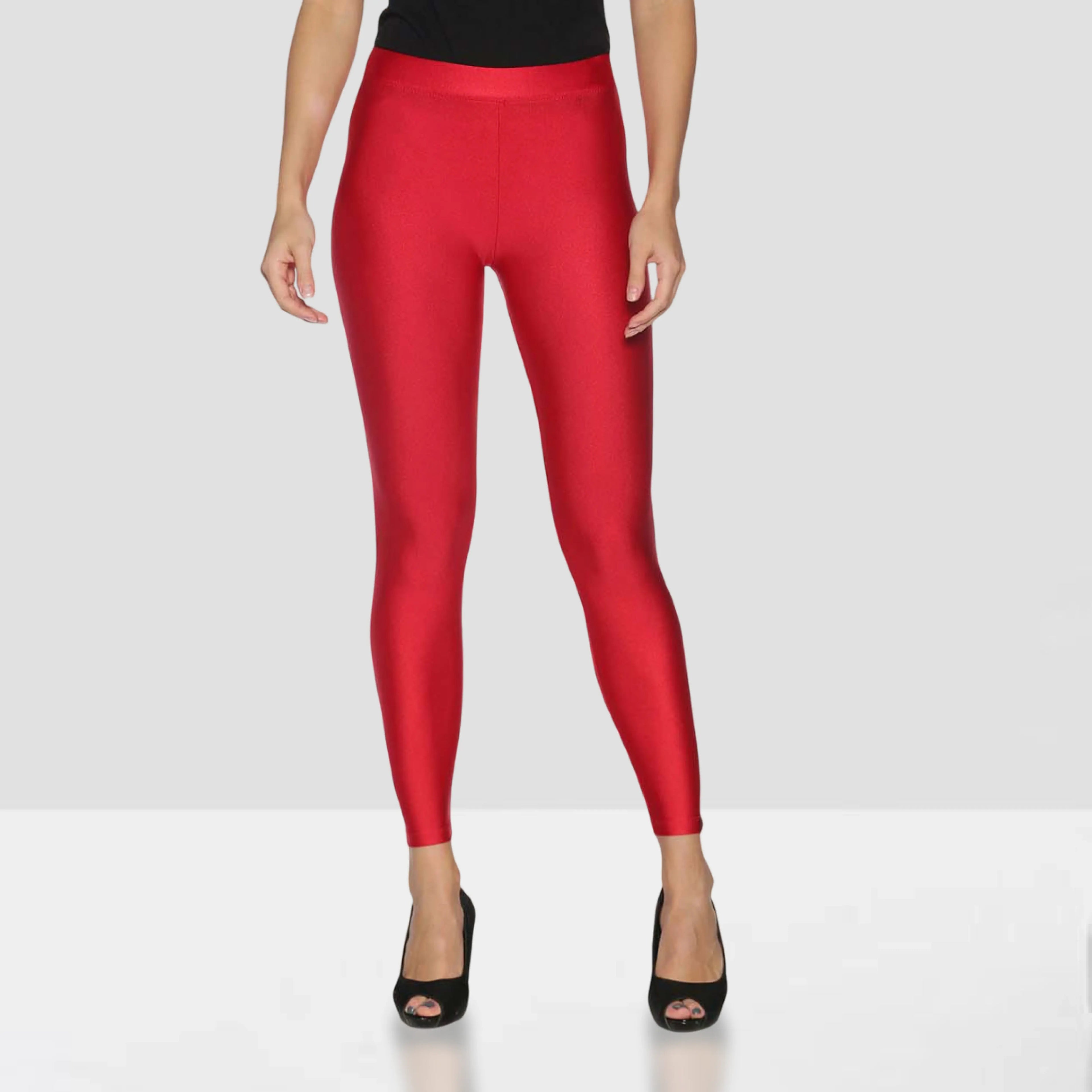 Red leggings worn by a person on a white background