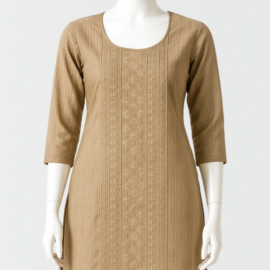 Beige dress with intricate patterns on a mannequin against a white background