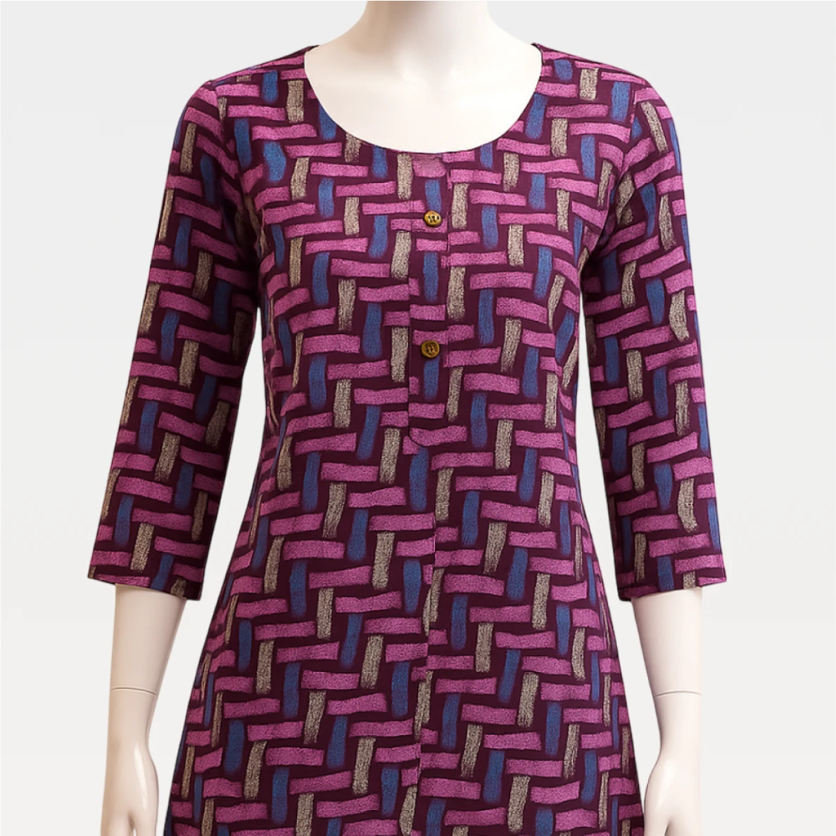Mannequin wearing a patterned dress with a geometric design on a plain background