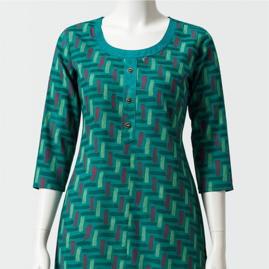 Green patterned dress on a mannequin against a white background