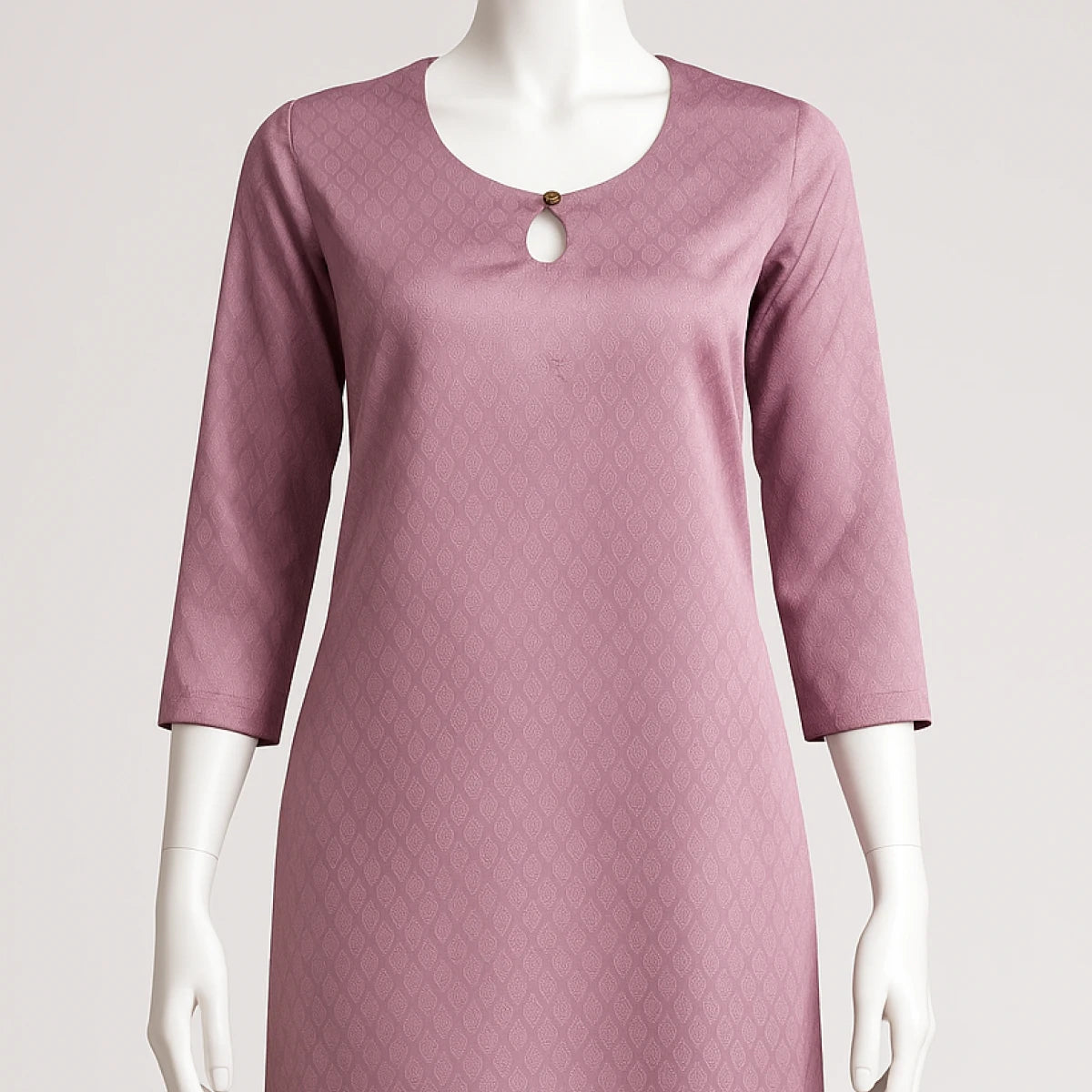 Mauve dress on a mannequin against a light gray background