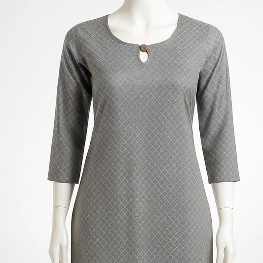 Gray patterned dress on a mannequin against a white background